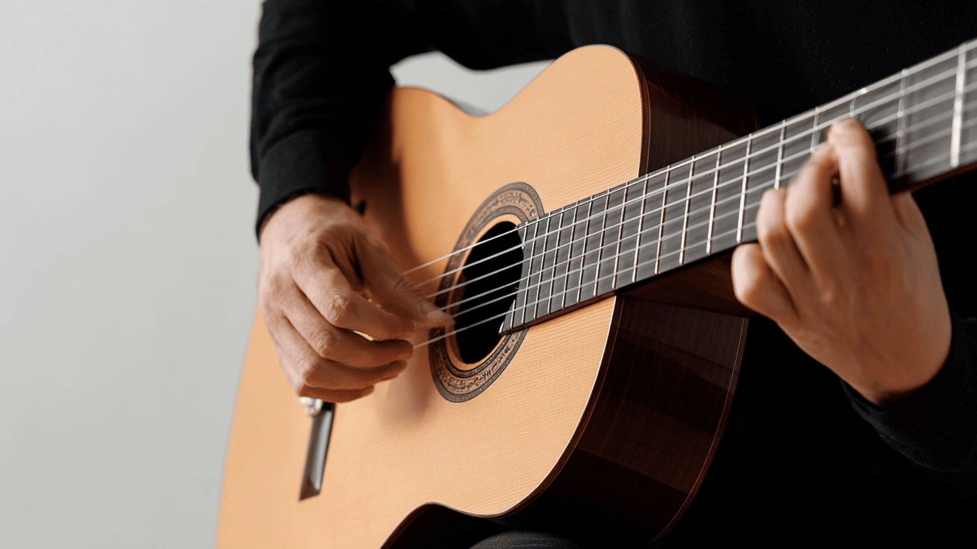 a-person-playing-classical-guitar
