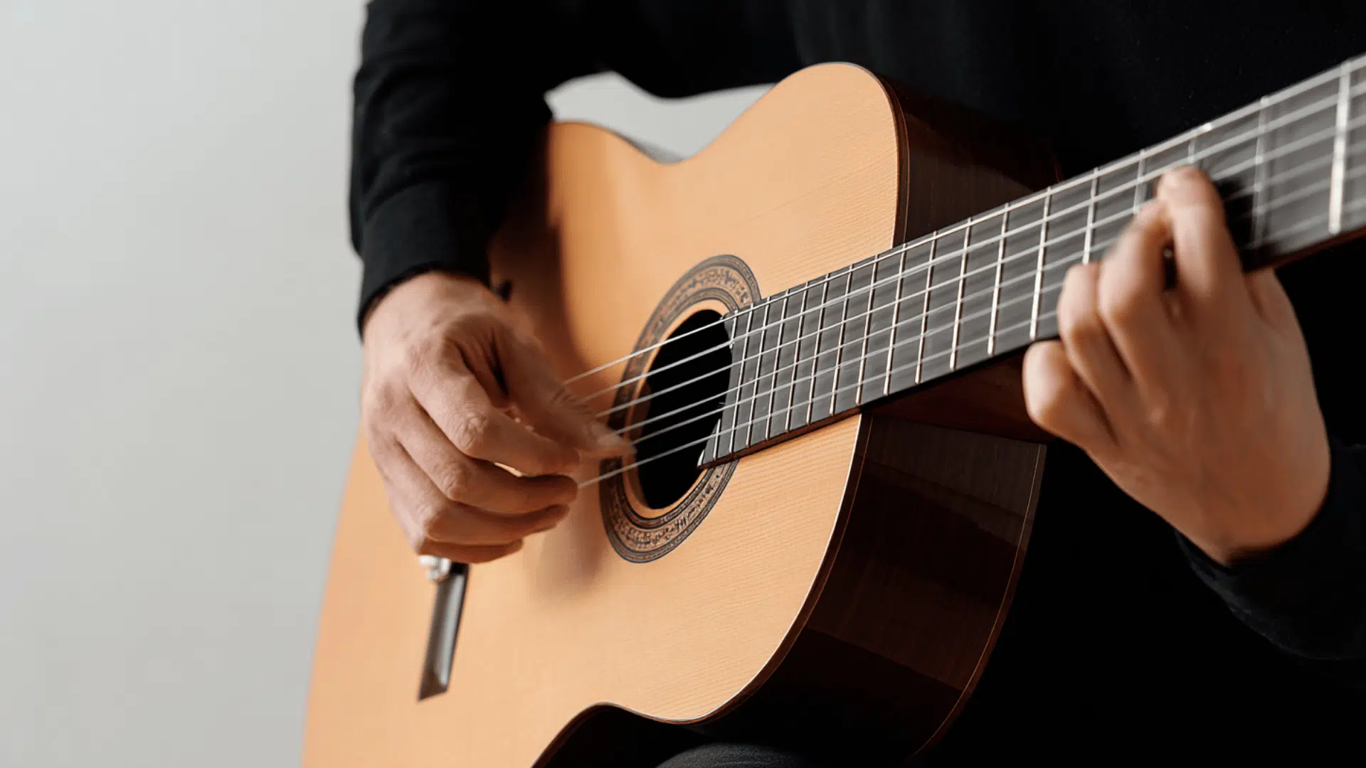 a-person-playing-classical-guitar
